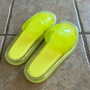 Tory Burch neon yellow bubble jelly slides.